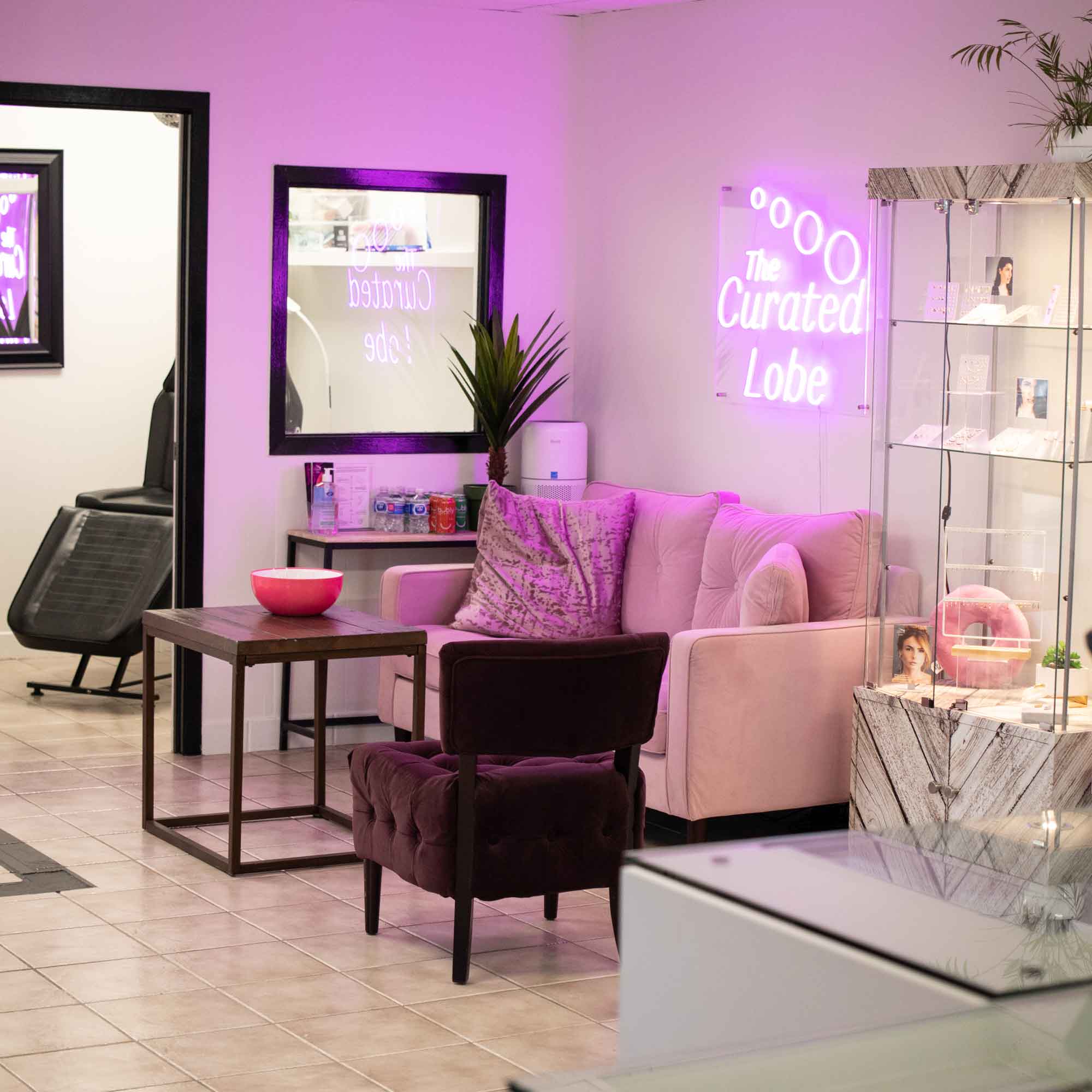 the curated lobe piercing studio interior lounge Oakville 