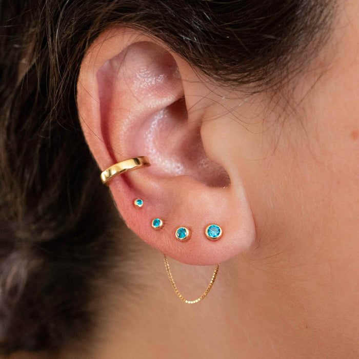 Yellow Gold Studs Graduated Blue Topaz Stud Earring Set The Curated LobeBirthstone Stud EarringsBlue Topaz StudsDecember Birthstone Studs